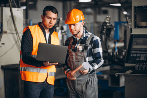 two-colleagues-working-in-warehouse-on-TMS-min